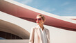 Fashionable portrait of stylish elegant woman, minimalism design architecture of a modern building