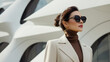 Fashionable portrait of stylish elegant woman, minimalism design architecture of a modern building