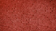 abstract stone cladding wall made of regular bright red bricks. abstract wall panels for decoration, background and texture. red wall made from grunge stone material for modern style decoration.