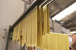 Tagliatelle pasta hanging to dry