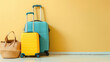 Suitcases well packed for a journey, stand against a bright yellow background complimenting the anticipation of adventure