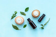 Herbal cosmetics with essential oils of medicinal fresh herbs, top view