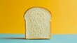 Slice of white bread on a blue and yellow background
