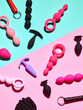 Sex toys background. Anal plugs and Dildo over pink backdrop