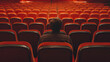 Man sitting alone in a movie theater or cinema