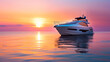 yacht charter. Luxury Yacht at Sunset. A white yacht floating on calm water with a colorful sunset in background.