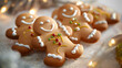 Man shaped Christmas gingerbread cookies decorated with white icing on a table
