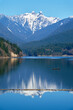 © maxdigi - Capilano Lake Lions Peaks Reflection North Vancouver vertical.
