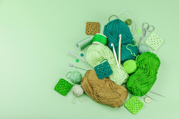 Wall Mural - A set of knitting yarn and tools in spring colors. Handmade concept, creative art, crafting process