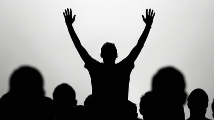 Silhouette of Christian worship with raised hands.