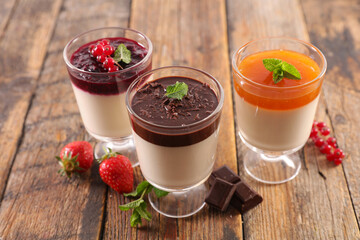 Wall Mural - panna cotta with berries fruits, chocolate and apricots sauce