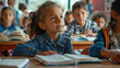 © Neha - group of kids sit at tables with books and study at primary school
