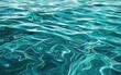 Clear, shimmering aqua blue water with gentle wavering patterns.