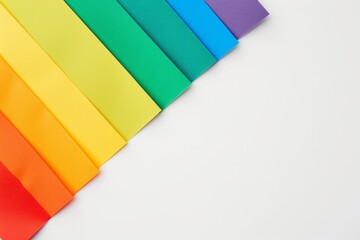 Wall Mural - Rainbow colored paper on a white background with copy space, in the style of pride flag colors Generative AI