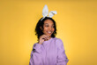 happy easter african american girl in bunny ears and sweatshirt on pastel background
