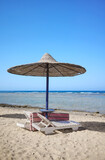 Fototapeta Nowy Jork - Beautiful sandy beach with sun loungers and umbrella, Marsa Alam region, Egypt.