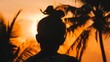 © Thanthara - Solo tourist watching sunset in Bali, close-up on peaceful expression, orange sky and silhouetted palms