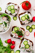 Canapes with cottage cheese with herbs and radishes.selective focus