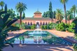 A serene painting of a fountain in a lush oasis. Perfect for travel brochures