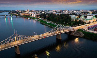 Wall Mural - Scenic aerial view of Tver cityscape on banks of Volga river overlooking Transfiguration Cathedral on summer twilight, Russia