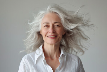 Wall Mural - Portrait of beautiful natural mature woman with grey hair