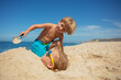 Children's beach day with sand games, digging and burying fun