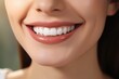 © Balaraw - Closeup of a smiling woman's face with perfect teeth