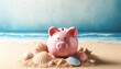 A pink piggy bank on sand with seashells by a beach backdrop. Summer vacation savings are fun with a pink piggy bank on sand.