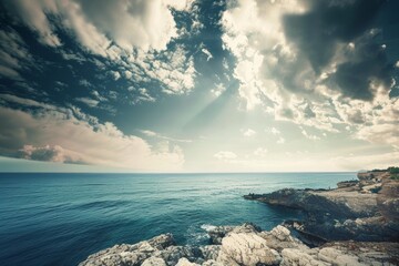 Wall Mural - Serene coastal landscape showcasing the dynamic interaction between dramatic sky and tranquil sea.