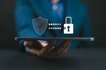 Fototapete - Cyber security. Business, technology, internet and networking concept. Young business man working on his laptop in the office, select the icon security on the virtual display.