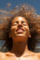 Canvas Print - Joyful woman with curly hair enjoying the sun