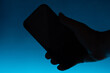 Smartphone in hand silhouette