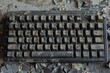 A keyboard with keys in disarray, some broken and missing, representing a communication breakdown
