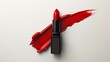 © TONSTOCK - a red lipstick with a smear of red lipstick