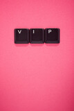 Fototapeta  - Close-up of the keys of an old keyboard creating vip word
