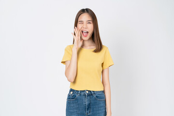 Wall Mural - Young asian woman shouting and hands over mouth on white background studio.