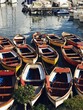 Traditional fishing boats in a small harbour on Procida Island, Italy