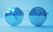 A pair of sunglasses with a blue frame