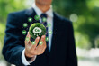 Carbon neutral or offset concept to Net zero greenhouse gas emissions target. businessman holding a globe with icon carbon credit reducing to a sustainable climate solution to low carbon economy.