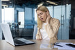 © Tetiana - Businesswoman suffering from otitis pain in modern office