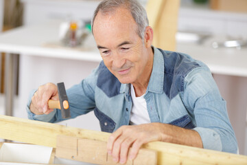 roofer builder working on roof structure