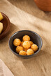 Cheese Tempura Balls Served in a Ceramic Bowl on a Rustic Wooden Table, Casual Dining Concept