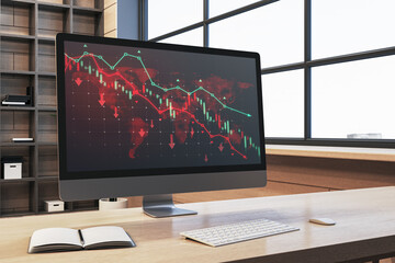 Sticker - Close up of wooden office desk with book and downward red forex chart on computer monitor. Blurry background. Stock, trade and report concept. 3D Rendering.