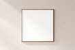 A minimalist blank picture frame hung on a textured wall, ideal for inserting your personalized content, 3d render.