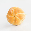 fresh baked roll (bun) on a white