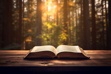 Wall Mural - Open book on wooden table, forest background