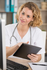 woman doctor with tablet at the office