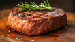Juicy beef steak medium rare with rosemary and pepper