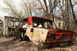 Old broken car. Exclusion zone of the Chernobyl nuclear disaster in Ukraine