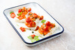 Roasted white fish with tomatoes and basil